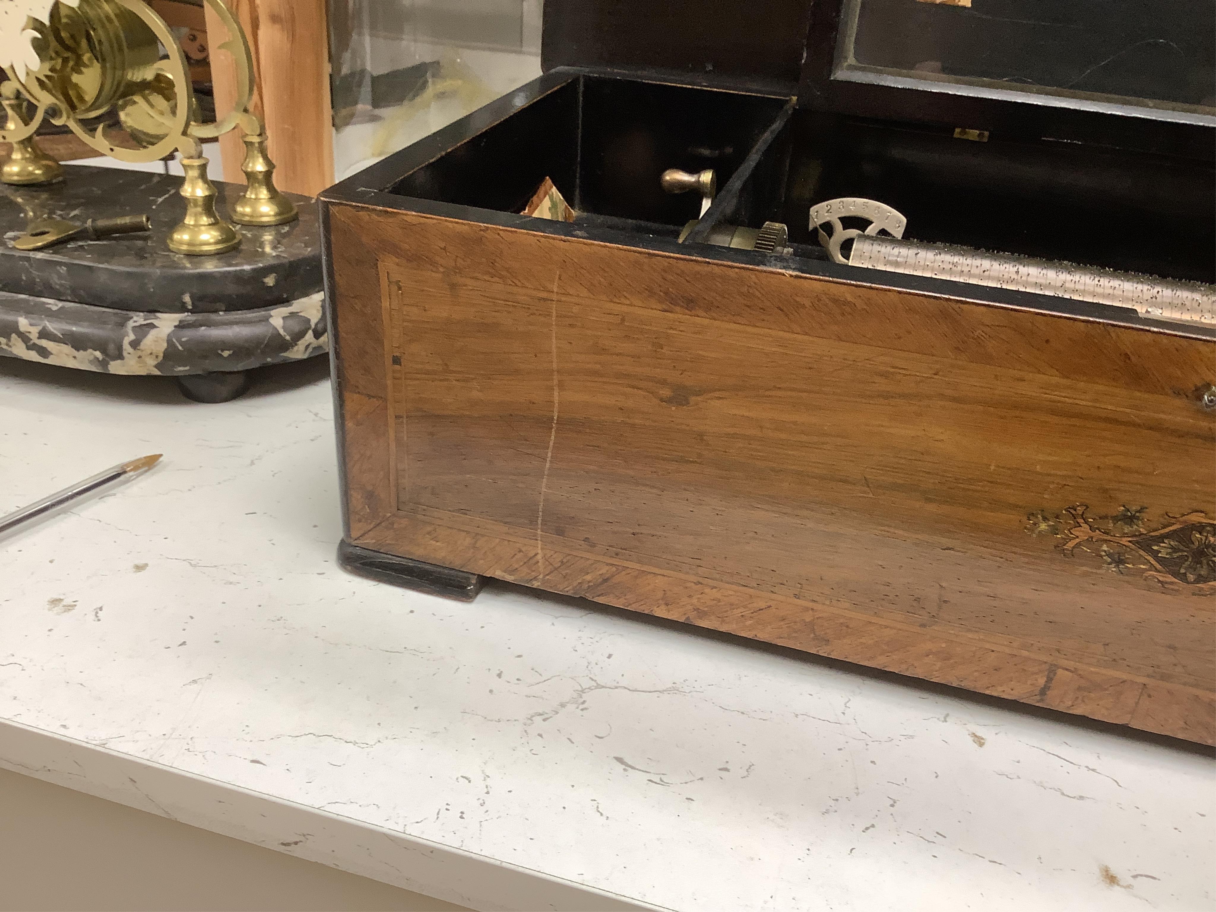 A late 19th century Swiss cylinder music box, 56cm wide.